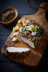 Delicious roasted turkey breast served on wooden board