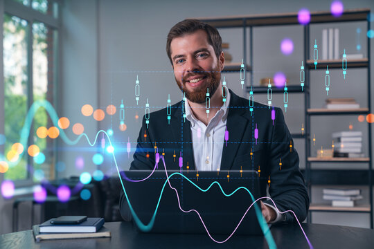 Smiling businessman in formal wear working on laptop at office workplace with smartphone and notebooks. Concept of successful business deal, agreement. Forex chart, financial graph, stock market icons