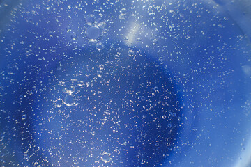 Oil bubbles close up. circles of water macro. abstract light blue background