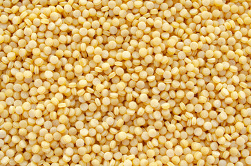 Ptitim background closeup, top view. Israeli heap of couscous, background, texture, top view. Heap of ptitim, background, texture, top view.