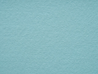 Soft blue matte felt material texture. Full frame matt backdrop wallpaper. Matt retro velvet pattern or vintage background in high resolution. Natural wool for text, lettering, patchworkor 3d art.