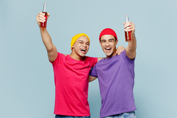 Young cheerful oyful happy fun cool couple two friends men wearing casual clothes together look...