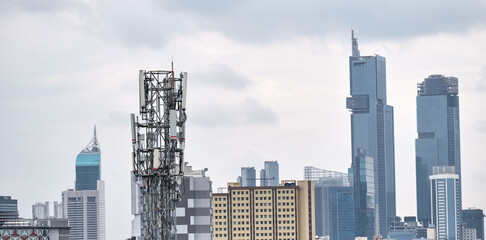 Urban landscape with buildings and signal-transmitting tower