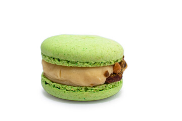 Green colorful macarons isolated on white background. Tasty red, green, brown, violet macaroons.