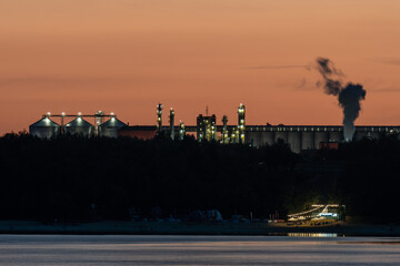 Lake Nyskie at night and an ethanol production plant in the background
