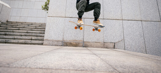 Skateboarder skateboarding in modern city © lzf