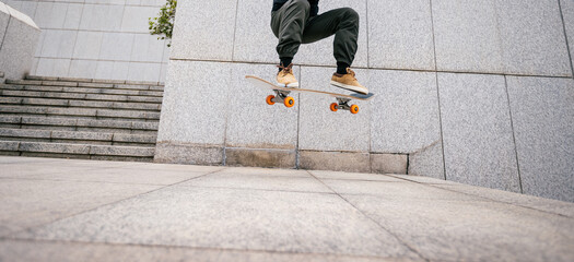 Skateboarder skateboarding in modern city