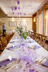 Elegant table setup in purple pastels for a restaurant wedding