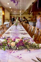 Elegant table setup in purple pastels for a restaurant wedding