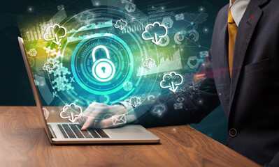 Business hand typing on a modern laptop