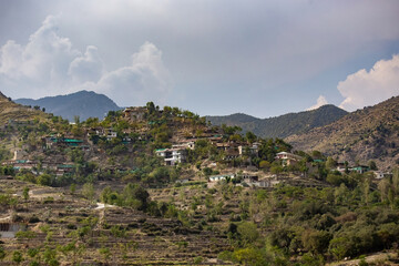 Fototapeta na wymiar Traditional Pakistani village houses on the hill in rural area of Northern Pakistan
