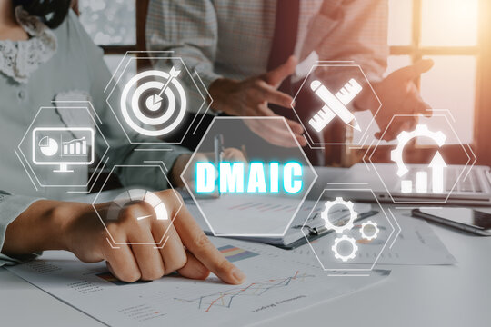 DMAIC is an acronym for Define, Measure, Analyze, Improve and Control concept, Business team analyzing financial data on office desk with DMAIC icon on virtual screen.