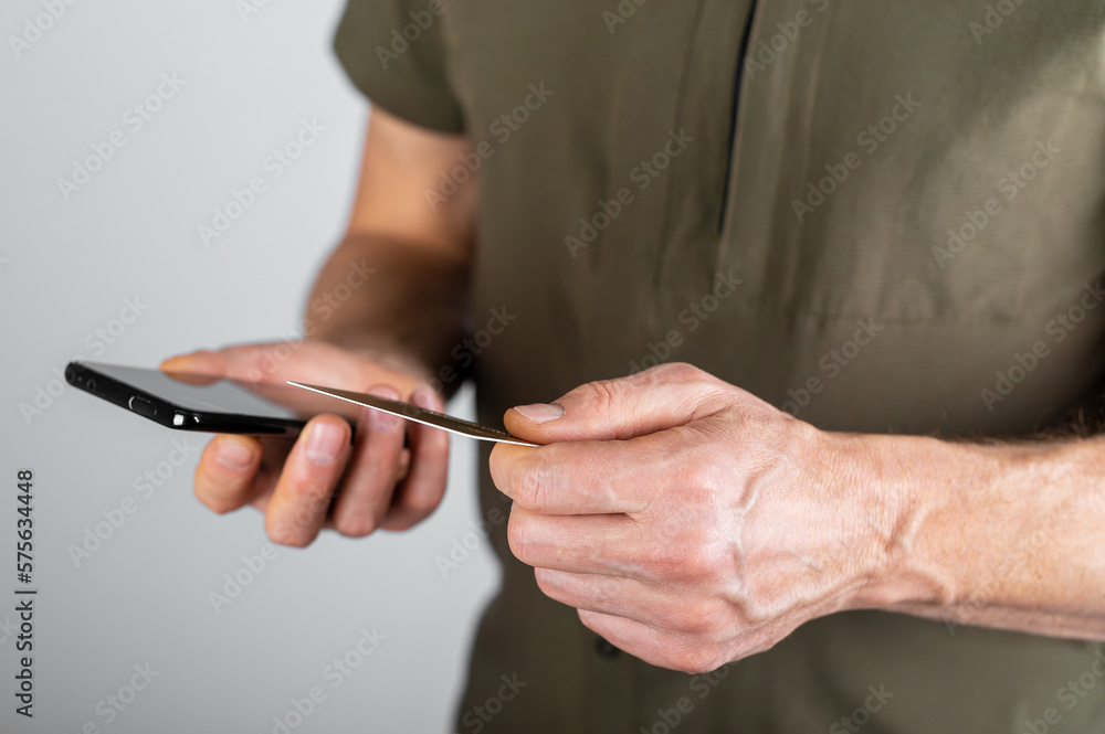 Poster hands paying online with bank card and mobile phone app. abstract virtual payment via internet