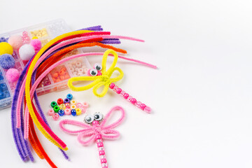 Beaded Pipe Cleaner dragonflies. Easy  kids crafts. Different multi-colored supplies and materials...