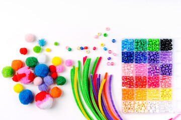 Set for children's crafts. Pipe Cleaners, beads and colorful pom-poms. Different multi-colored...