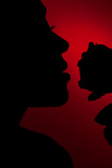 silhouette woman on red background
 smells rose 