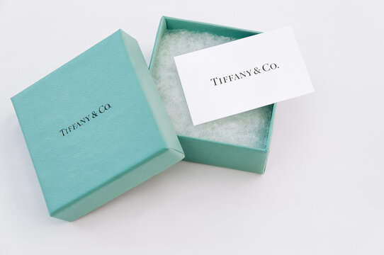 Tiffany Open box with a white card and the name of the company.