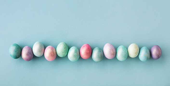 Pastel Easter eggs for Easter background. Top view and flat lay style.