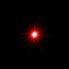 The red light of a star glowing from the darkness.