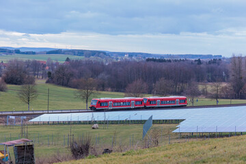 Solar park in a rural environment in front of a railroad line in Gaishaus near Ravensburg in Baden...