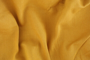 A yellow crumpled fabric texture background