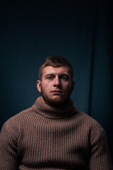 Obraz premium Vessel captain. A man in a sweater and cap. Smokes a pipe. Male profession.