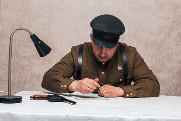 Soldier of the Russian army of the 20th century. Civil service officer in a cap, military uniform...