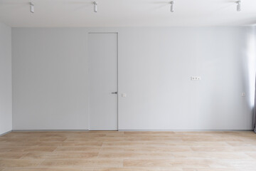 Empty gray room ready for people to move in