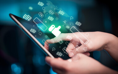 Close-up of a hand using tablet, social media concept