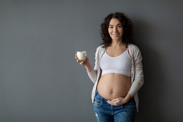 Healthy Drink. Portrait Of Beautiful Pregnant Female Holding Glass Of Milk