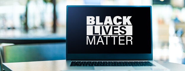 Laptop displaying the sign of Black Lives Matter movement
