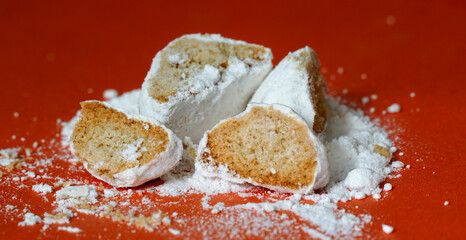 vanilla cookies crackers with sugar powder on orange background, sweet food theme