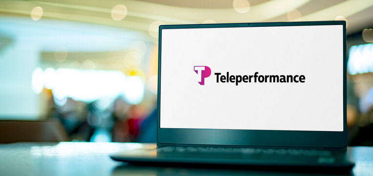 Laptop computer displaying logo of Teleperformance