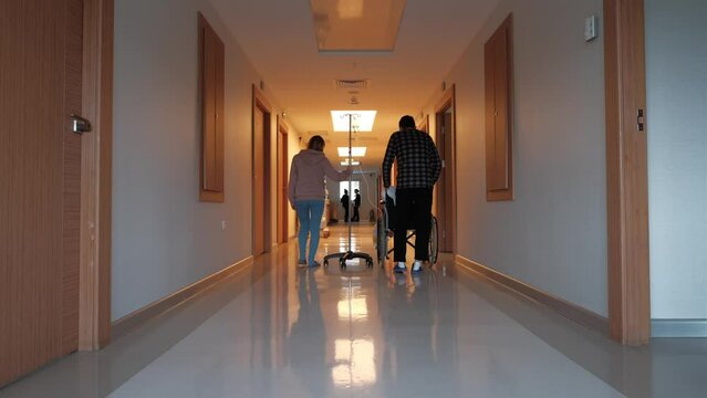A child with his parents in the hospital after a kidney transplant