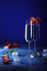 Two glasses of champagne with strawberry