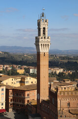 Fototapeta na wymiar Famous Bell Tower called TORRE DEL MANGIA in Siena City Italy