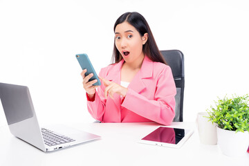 Overjoyed surprised Asian business woman holding smartphone look at camera get surprised unexpected news Excited working woman get job promotion online lottery win Office girl sit on chair at office