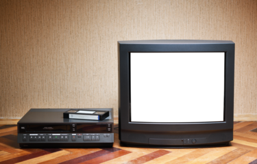 Old TV with a white screen and a VCR on the background of the wallpaper.