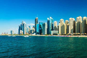 Fototapeta na wymiar Dubai feaes a landscape and together with modern buildings. beach, shore, sea , resort