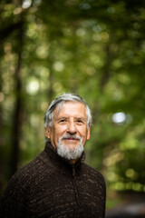 Elderly caucasian male walking outdoors on an autumn, fall day
