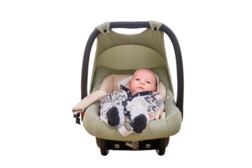A child boy in an infant car seat, isolated on a white background. Infant baby in carrying. Kid aged two months