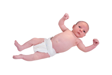 Portrait of a baby boy aged 1 month lying with his eyes open in a crib, isolated on a white background. Caucasian child in the children bedroom on the bed
