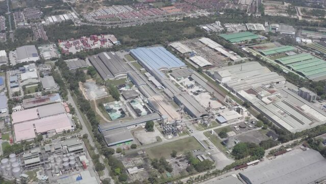Aerial view of factory buildings in Vietnam nearby greenery