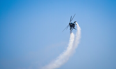 helicopter chopper airshow airplane flight formation with contrail