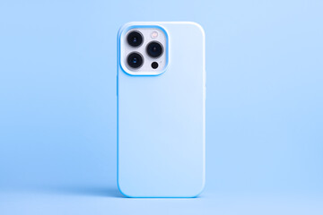 iPhone 13 and 14 Pro Max in blue case back view isolated on blue background, phone cover mock up in...