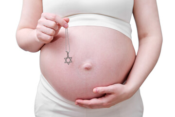 A symbol of the Jewish religion in the hands of a pregnant woman, a studio photo, isolated on a white background