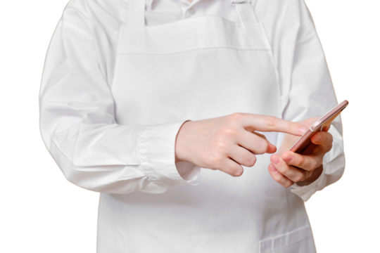 Man chef presses his finger on the screen in the phone on a isolated white background.