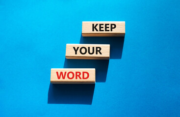 Keep your word symbol. Wooden blocks with words Keep your word. Beautiful blue background. Business and Keep your word concept. Copy space.