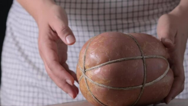 Mortadella. Traditional pork sausage with pistachios or black pepper. Italian delicacy from Bologna. High quality 4k footage