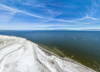 Obraz premium An Aerial UAV Drone View of the West Coast of the Salton Sea Near Thermal, California, Showing the Evaporated Salts from the Water and the abandoned Marina with the Infrastructure Seen in the Salt 